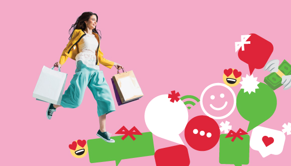 "une personne marche avec des sacs d'achats, avec des emojis et bulles de parole en forme de cadeaux et décorations des Fêtes"