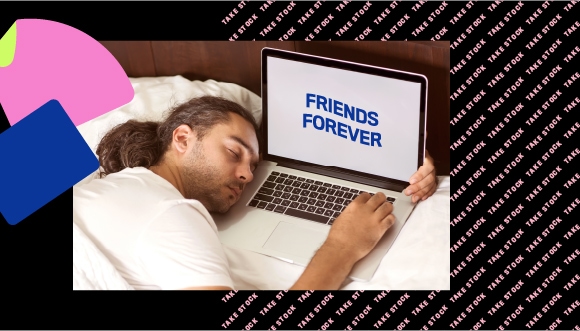 a person sleeping next to a laptop, which has text "friends forever" on screen