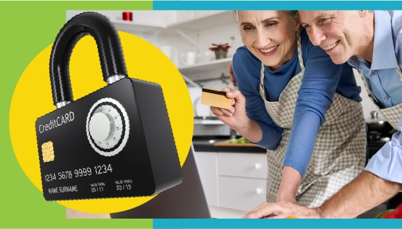 an older couple in a kitchen look at a laptop, with a credit card in one hand; a padlock that looks like a credit card on the front